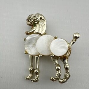 Gold Tone Poodle Shaped Brooch with Mother of Pearl, White Accents, Green Eye